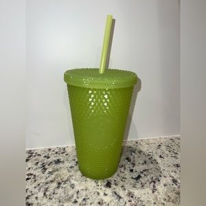 Starbucks green studded glow in the dark cup.